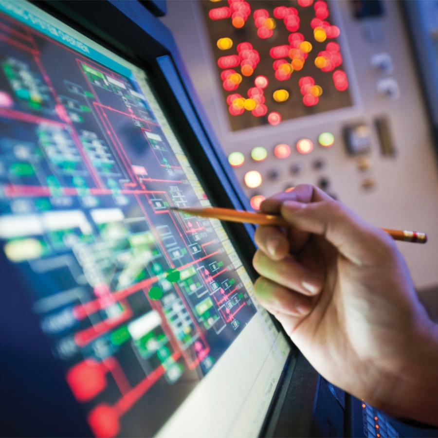 Pencil in hand touching a digital Computer screen