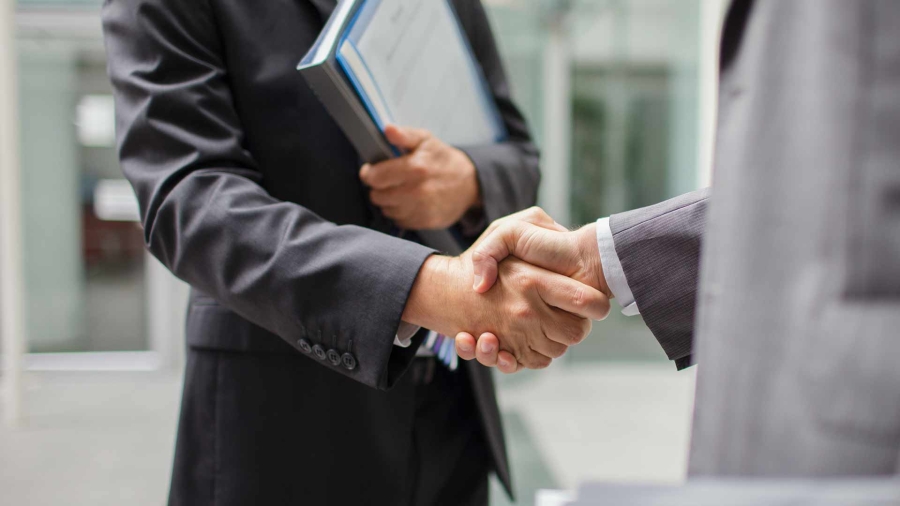 Closeup of two men shaking hands