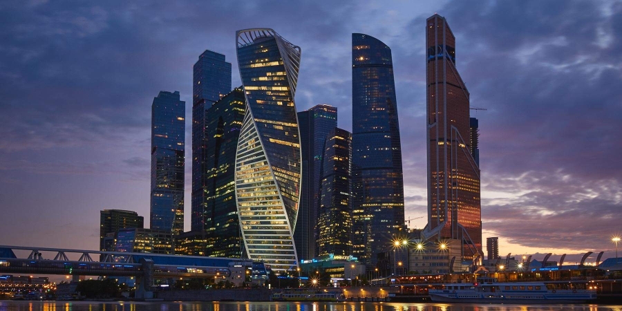 low angle shot of illuminated modern buildings at night