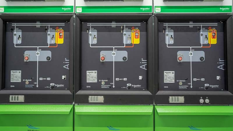 A row of green and black machines