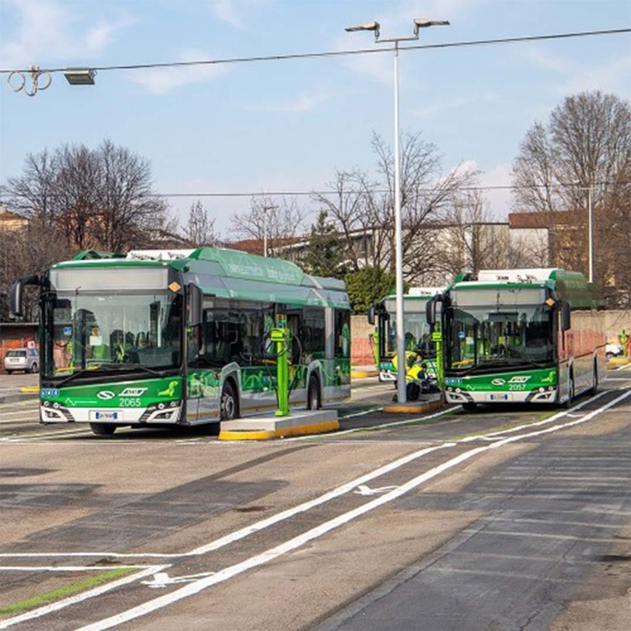 A group of buses parked on a street