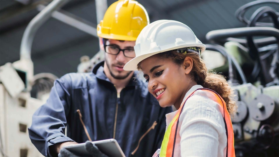 A person wearing hardhats and a person wearing a helmet