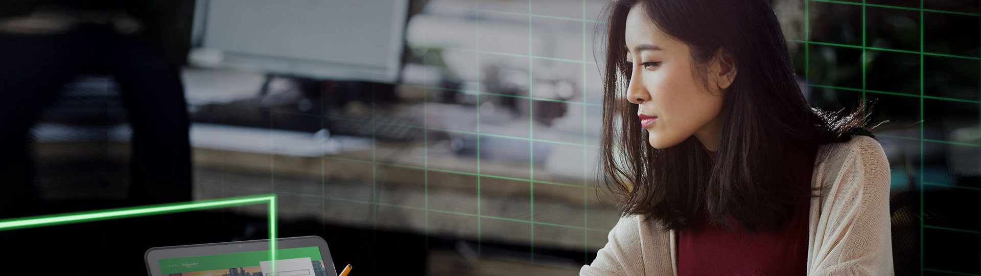 A woman is looking at the computer